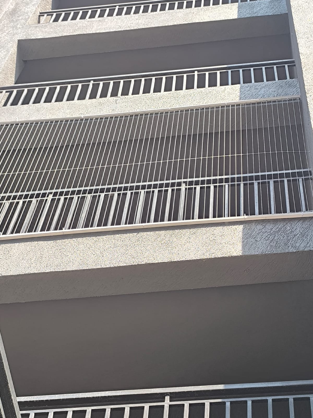 Exterior view of a building with invisible grills fitted